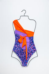 BAÑADOR NOOSA ANIMAL PRINT ASIMÉTRICO MORADO Y NARANJA FLÚOR